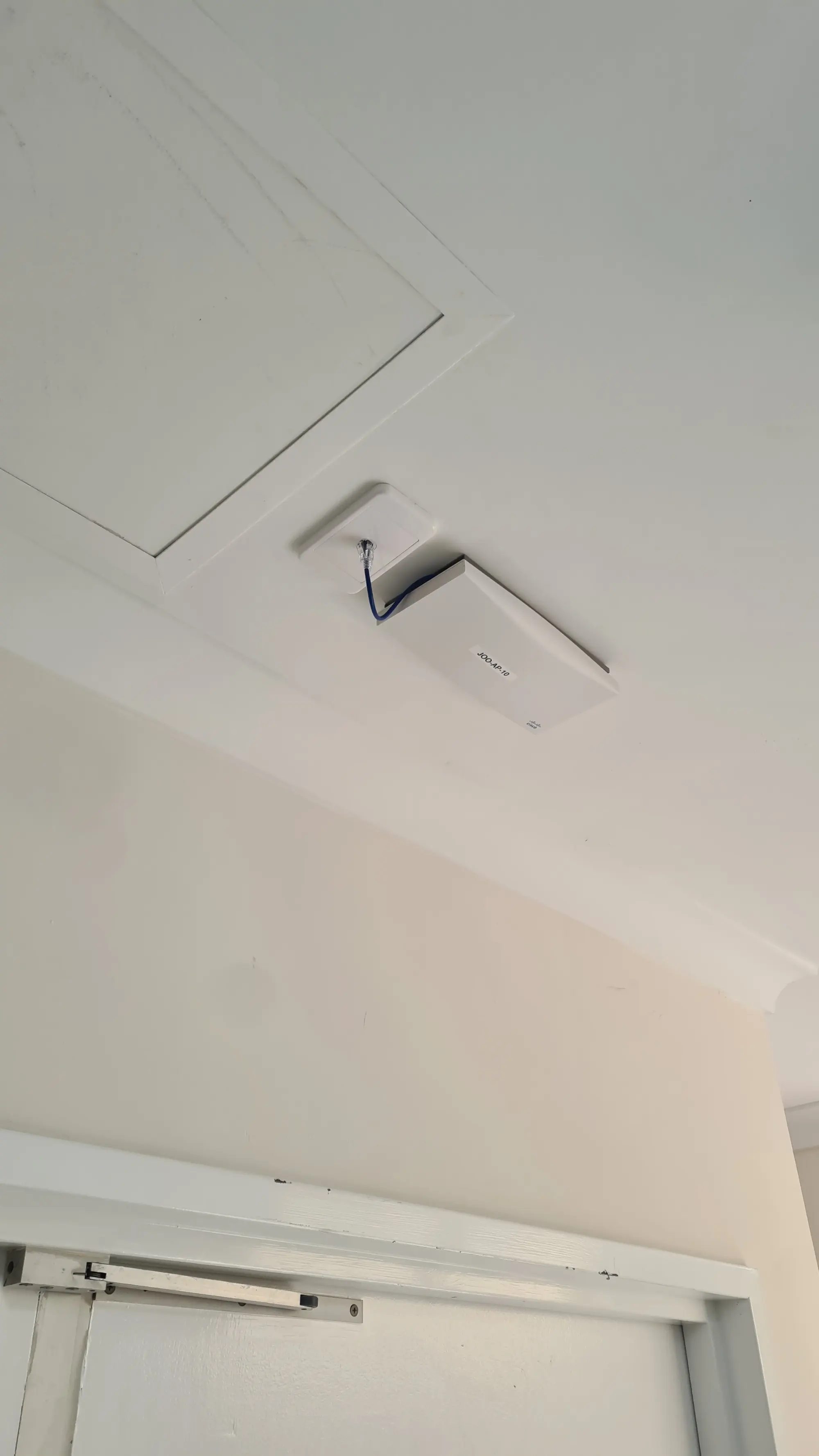 Ceiling-mounted WiFi access point installed in commercial aged care facility in Perth